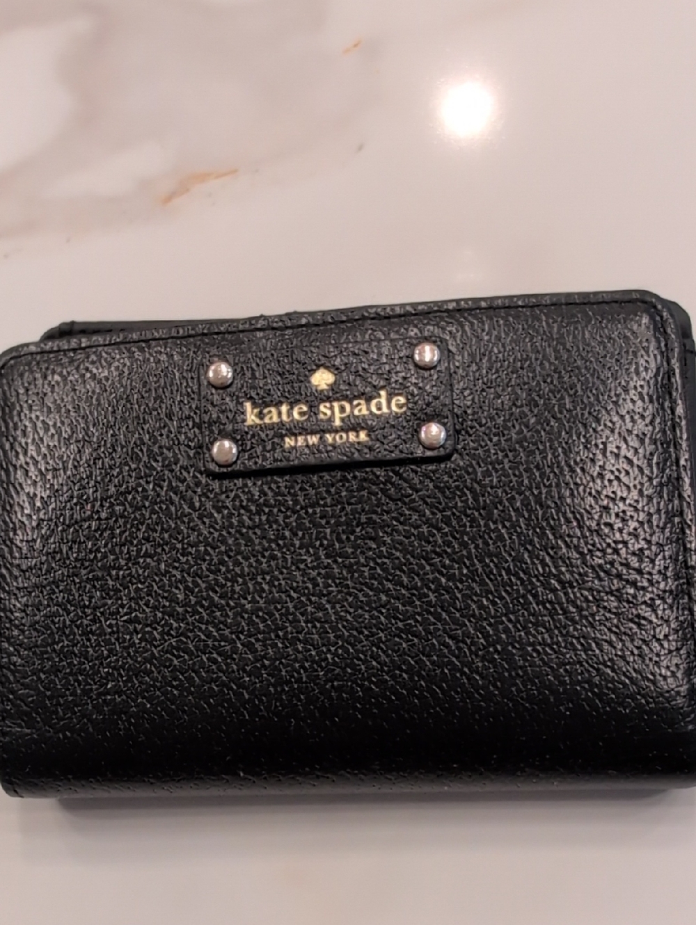 kate spade black pebbled leather wallet with gold logo